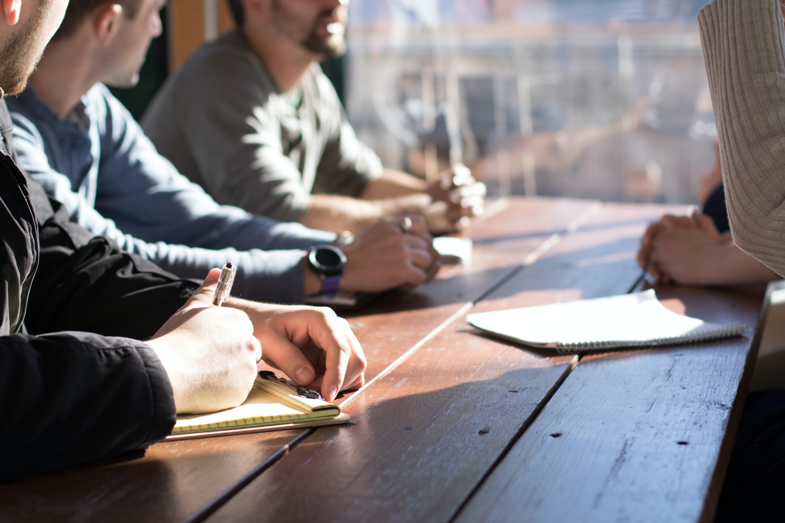 White coworkers meeting at a table