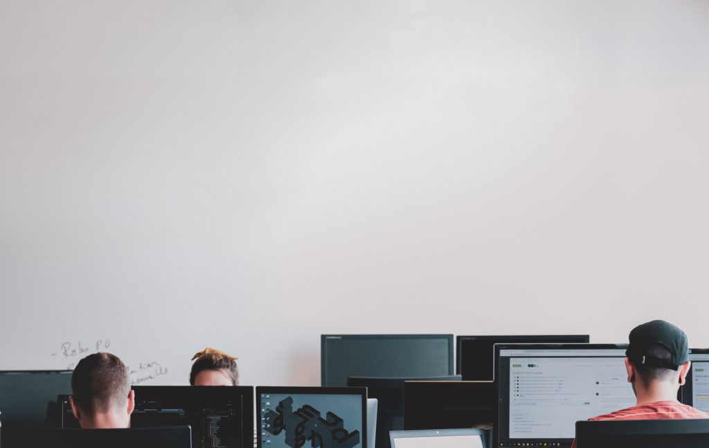 White office workers focued on their computers